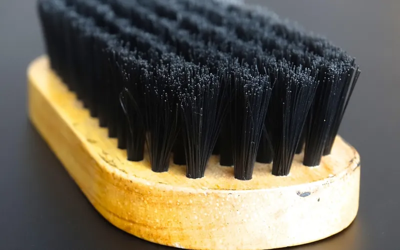 Stiff-bristle hand scrub brush with a wooden base
