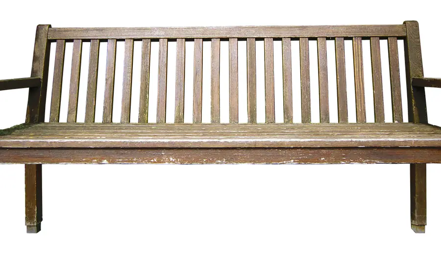 Outdoor wooden garden bench A wooden outdoor garden bench showing natural wood grain and weathering