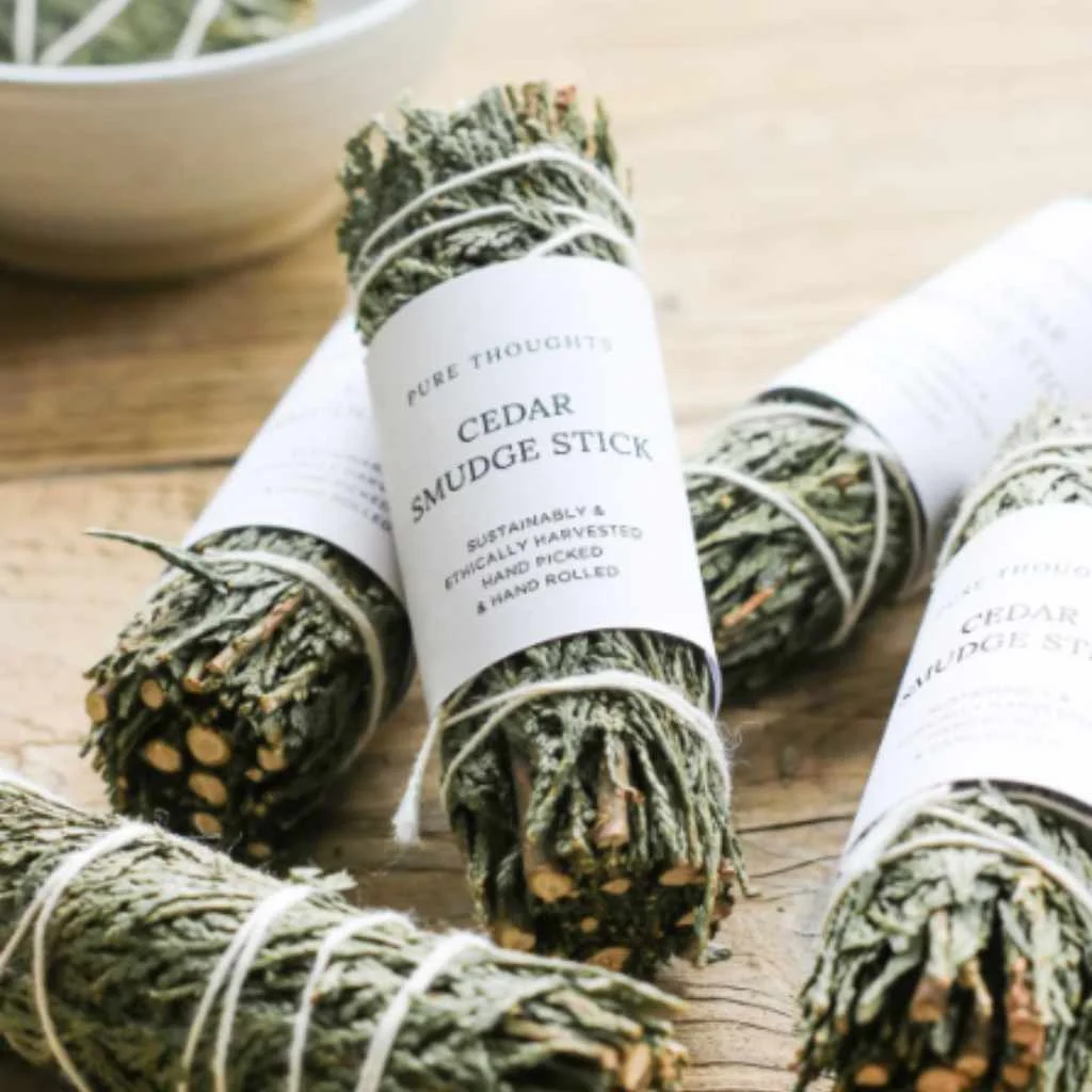 bundled cedar smudge sticks tied with string bundled cedar smudge sticks tied with string