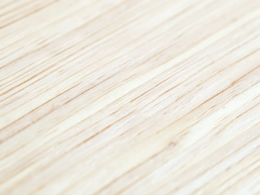 Close-up of ash wood surface showing its straight open grain pattern