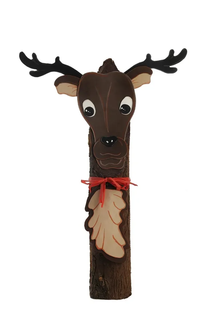 Handmade wooden reindeer figure with painted antlers and a red ribbon