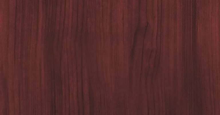 Reddish-brown mahogany wood grain close up