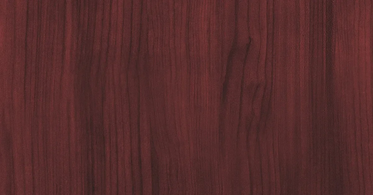 Reddish-brown mahogany wood grain close up