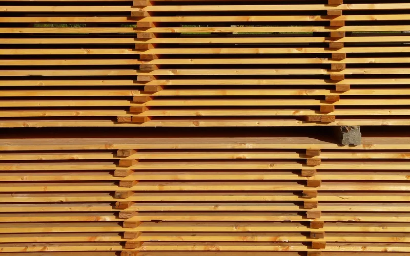 Lumber stacked in layers with air gaps for storage