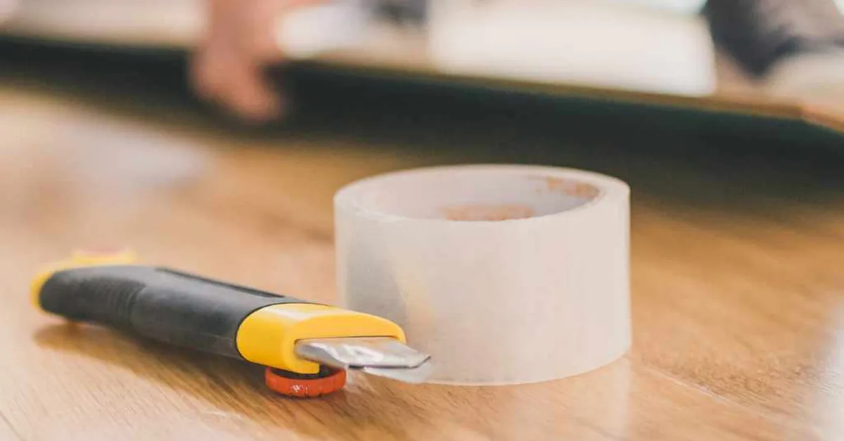 utility knife and tape used to seal underlayment seams before laying a floating floor utility knife and tape used to seal underlayment seams before laying a floating floor