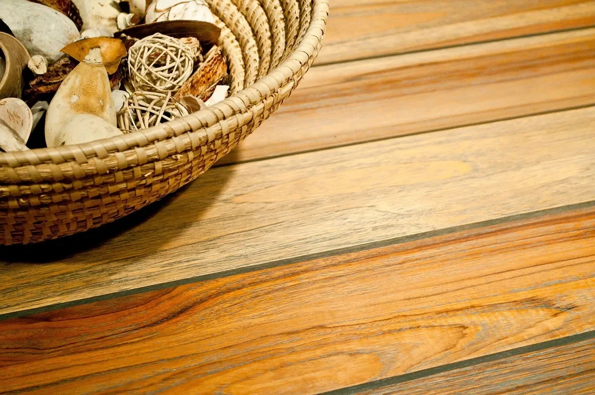 Warm golden-brown teak-toned wood planks