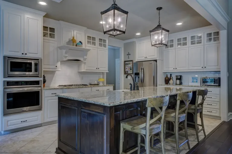 White shaker-style kitchen cabinets with glass-front uppers