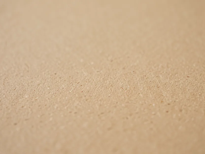 Close-up of the smooth non-porous surface texture of a wood fiber composite cutting board