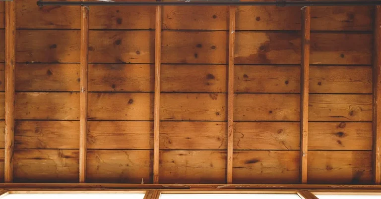 Wooden ceiling beams and boards inside a building