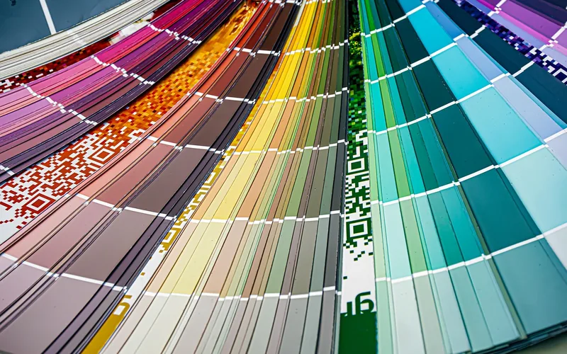 fanned-out paint color swatch deck showing hundreds of Benjamin Moore color chip options