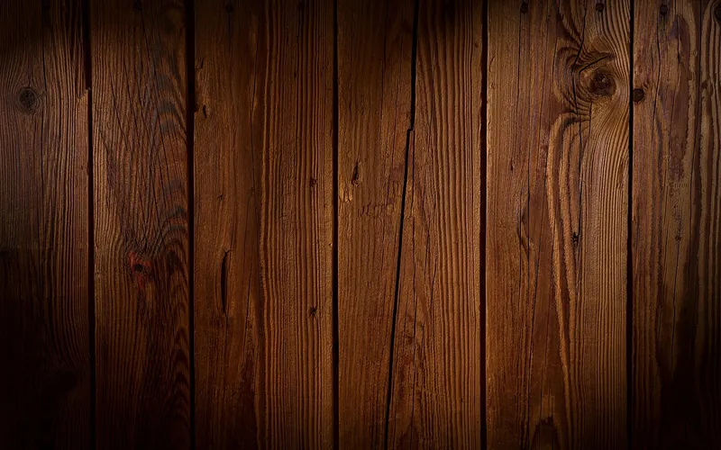 Dark natural wood planks showing real grain and knots