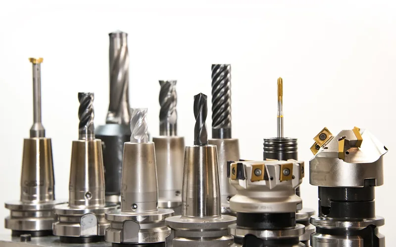 close-up of various metal twist drill bits standing upright