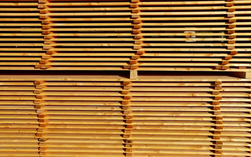 Stack of sawn boards separated by sticker strips for air drying
