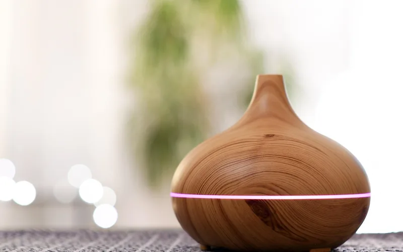 cedarwood essential oil diffusing from a wood-grain aromatherapy diffuser cedarwood essential oil diffusing from a wood-grain aromatherapy diffuser