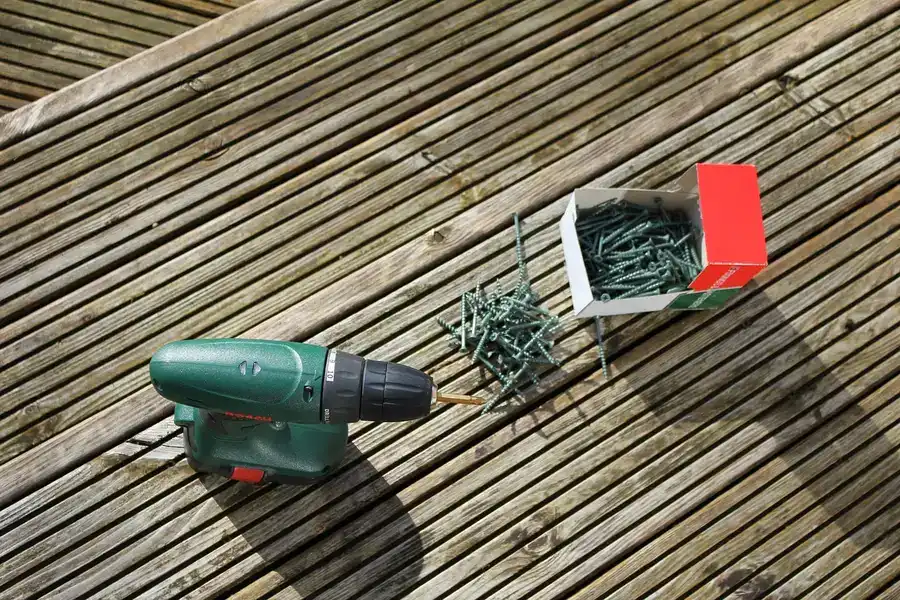 Installing deck boards with hidden fastener screws, a step shared across every composite decking brand Installing deck boards with hidden fastener screws, a step shared across every composite decking brand
