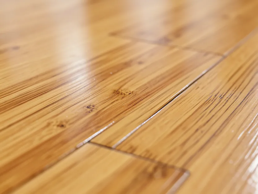 Close-up of prefinished bamboo flooring planks showing the natural wood grain and factory finish Close-up of prefinished bamboo flooring planks showing the natural wood grain and factory finish