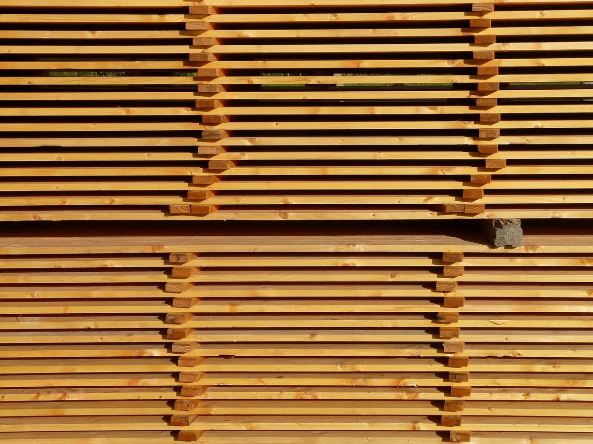 Stacks of lumber boards stored in a pile