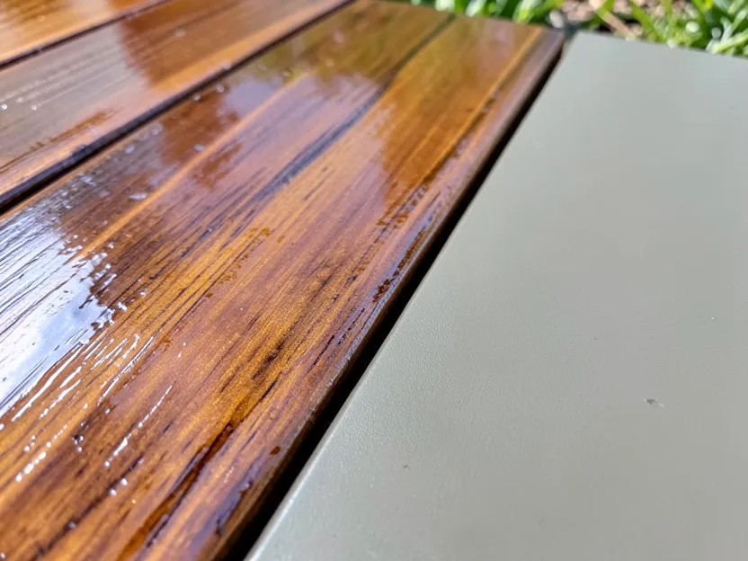 Wooden deck board showing glossy vs matte stain sheen comparison