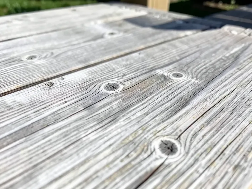 Unfinished cedar deck boards that have naturally weathered to a silvery-gray patina