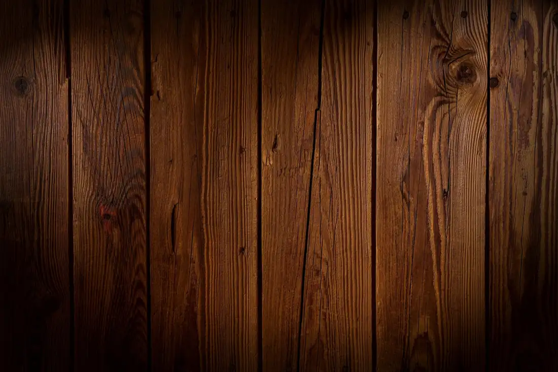 Close-up of wood grain and board seams, illustrating where a glue line sits in the grain