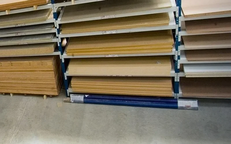 Sheet goods stacked flat on warehouse racks