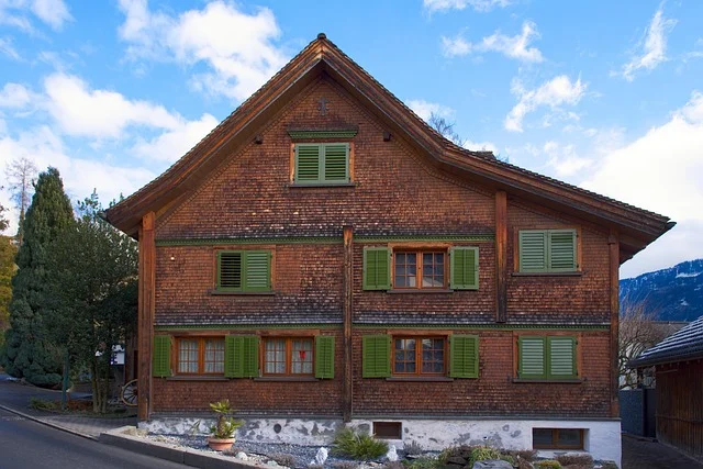Traditional home exterior clad in natural wood shake and shingle siding
