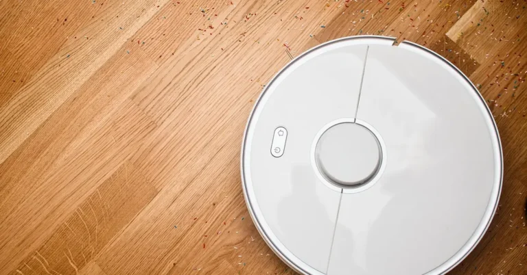 Robot vacuum cleaning debris from a hardwood floor