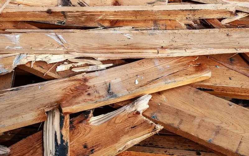 Pile of broken wooden boards with splintered ends Pile of broken wooden boards with splintered ends