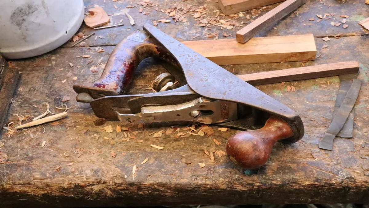 Danish oil and polyurethane tools with rag brush gloves and wood sample boards