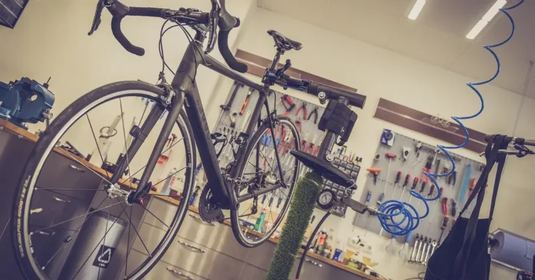 road bike lifted on a shop repair stand for drivetrain service