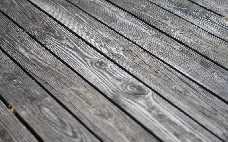 Wood deck planks drying outdoors after pressure washing