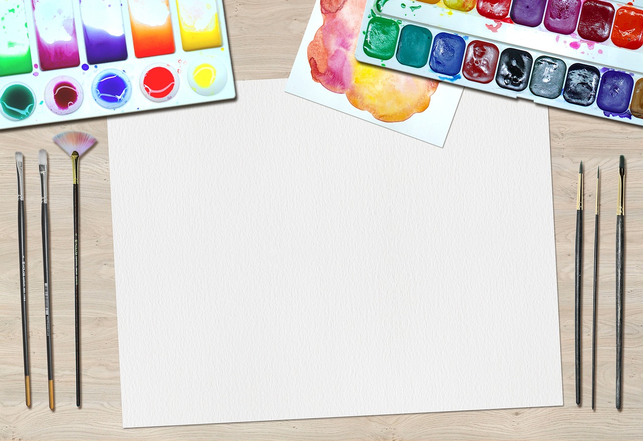 art supplies and workspace setup for woodblock printing including paper and ink