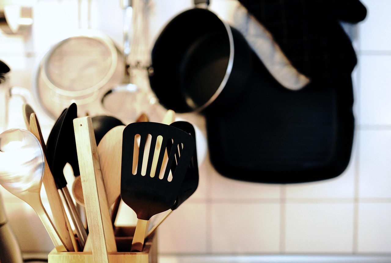Wooden cooking utensils including spoons and spatulas for kitchen use