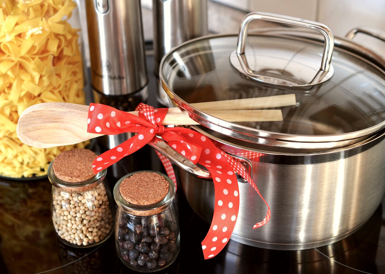 Wooden spoon used for cooking in pot on stove
