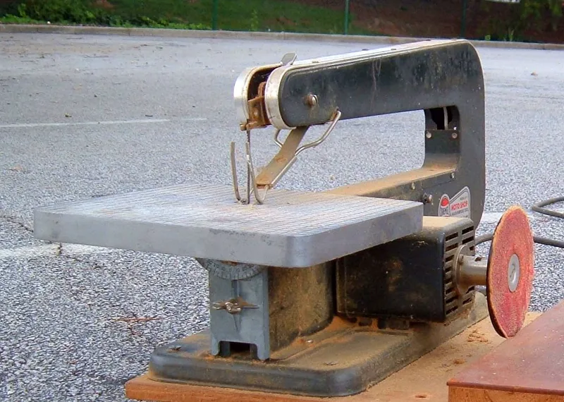 Variable speed scroll saw used for cutting small scrap wood project shapes