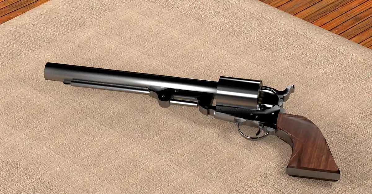 Wood pistol grip on a Colt-style revolver, hand-shaped from a walnut blank
