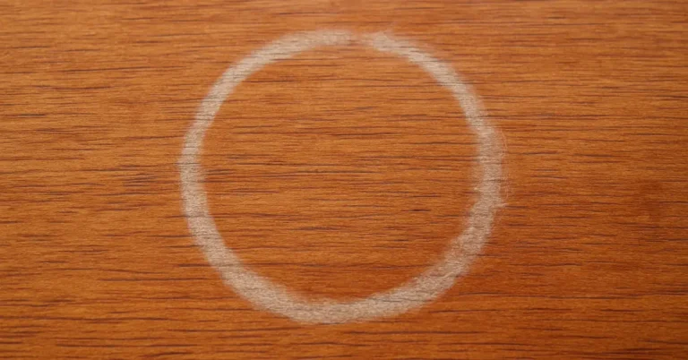 White cloudy water ring stain on a wood furniture finish