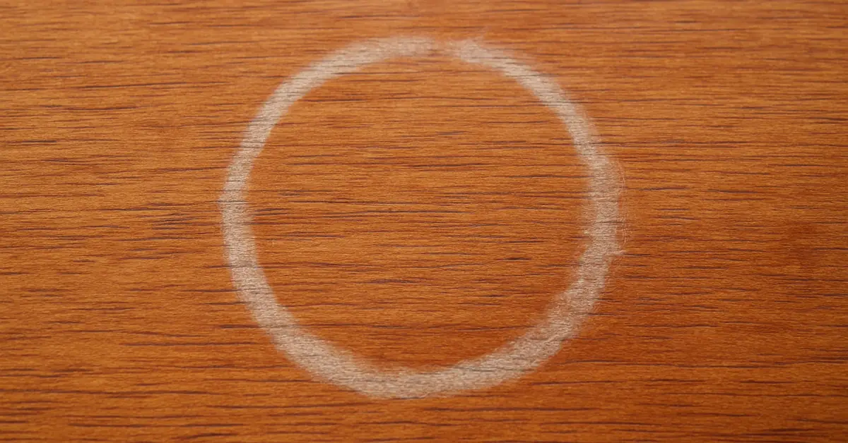 White cloudy water ring stain on a wood furniture finish