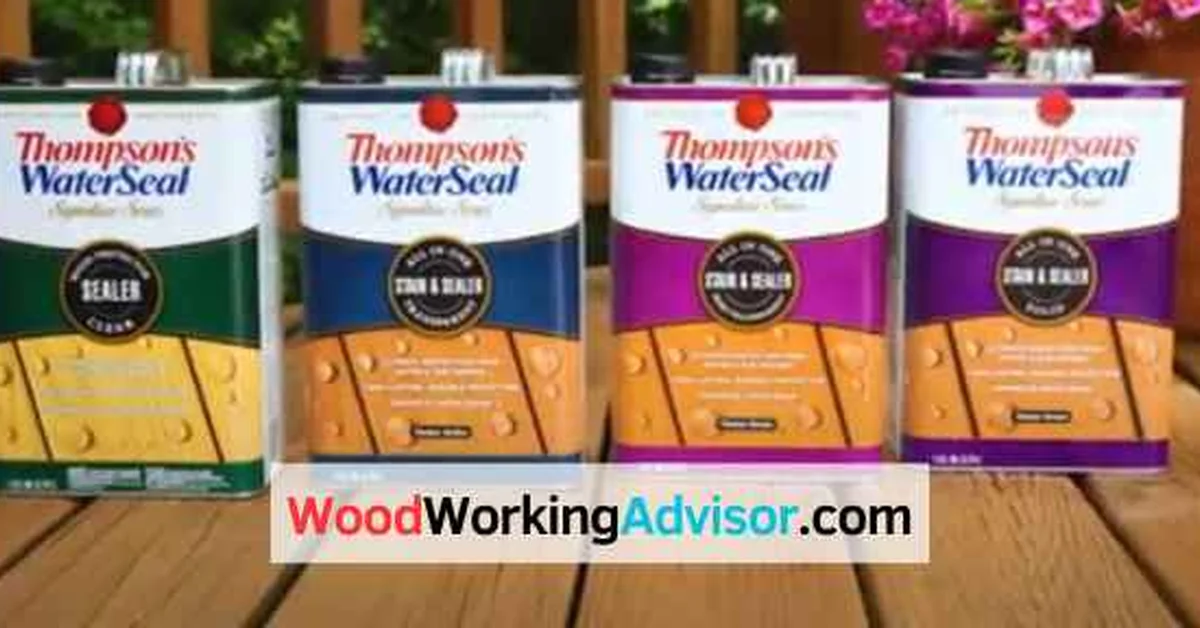 Four cans of Thompson's Water Seal lined up on a deck before painting