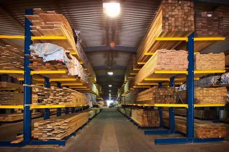 stacked lumber and sheet wood products at a timber yard warehouse