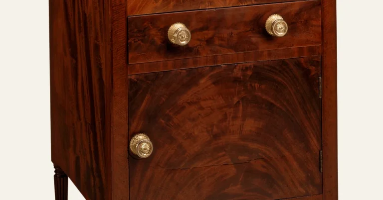 Close-up of a smooth, glossy stained mahogany cabinet showing the wood grain