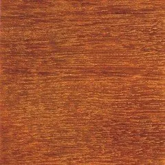 Hand spreading adhesive on a wood veneer sheet beside a plywood panel