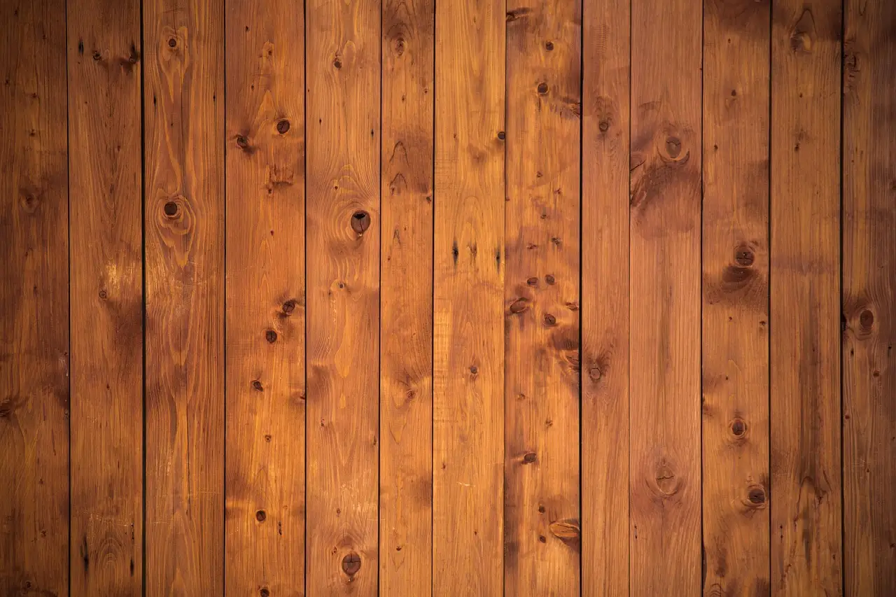 How do I glue a wood backing to a wall for heavy décor?