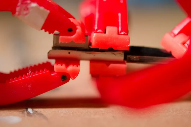 Homeowner mixing two-part epoxy beside a damaged wooden chair leg at a workbench