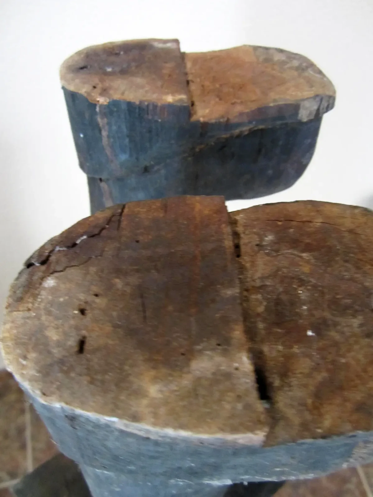 Close-up of white wood glue residue being scraped from a wood board edge
