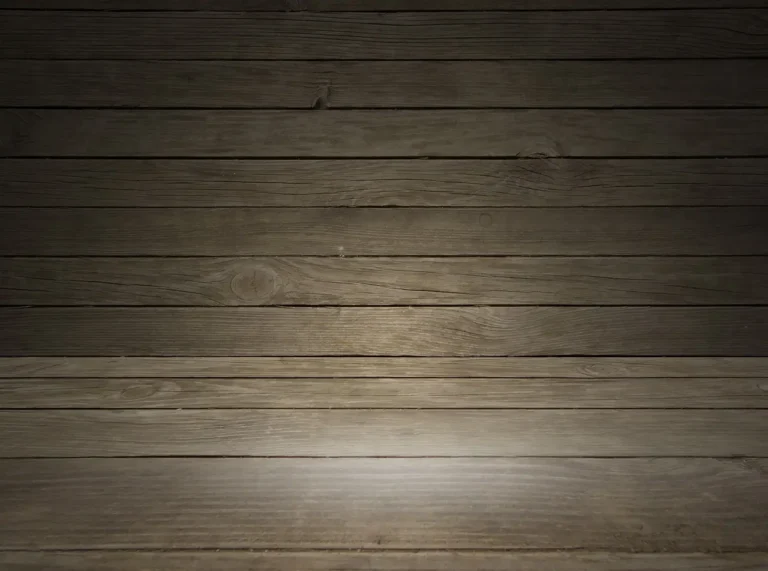 Ash vs oak flooring in a sunlit living room with two contrasting wood floor sections