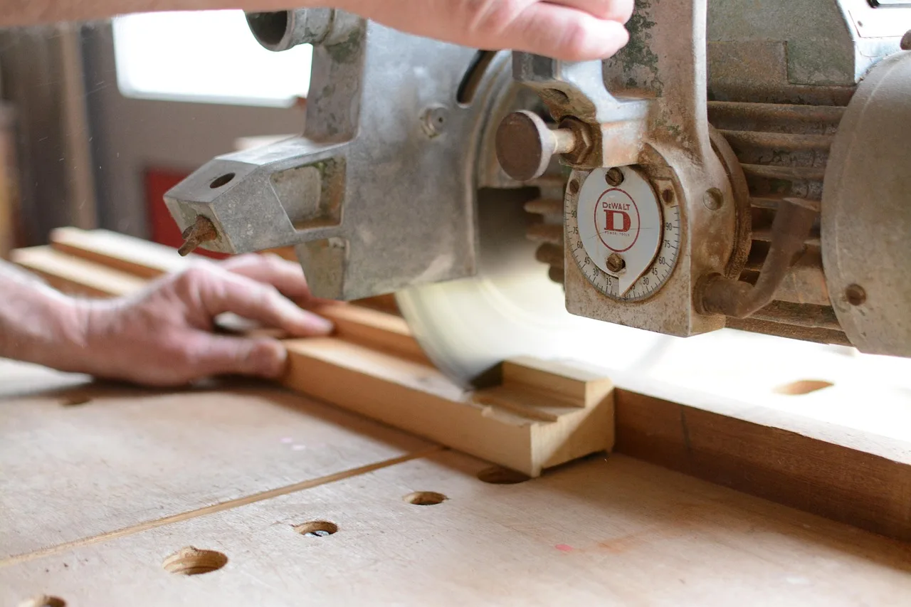 Band saw Christmas projects displayed on a workshop table with a saw in the background