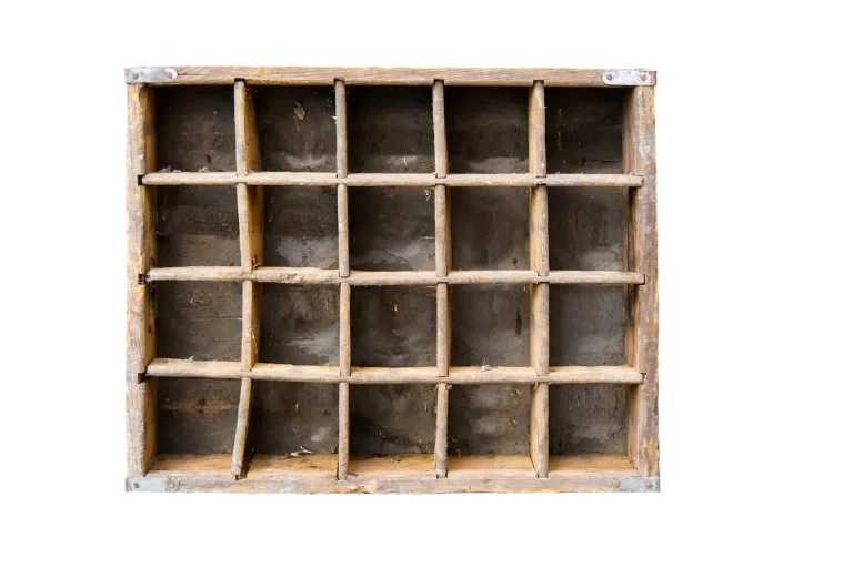 Small woodworking projects laid out on a workshop table with tools and sawdust