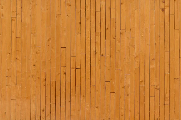 Hard maple test boards with different stain samples on a woodworking bench
