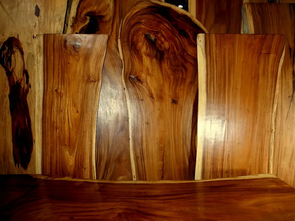 Close-up of Howard Feed-N-Wax being applied to scratched oak furniture with a cloth.